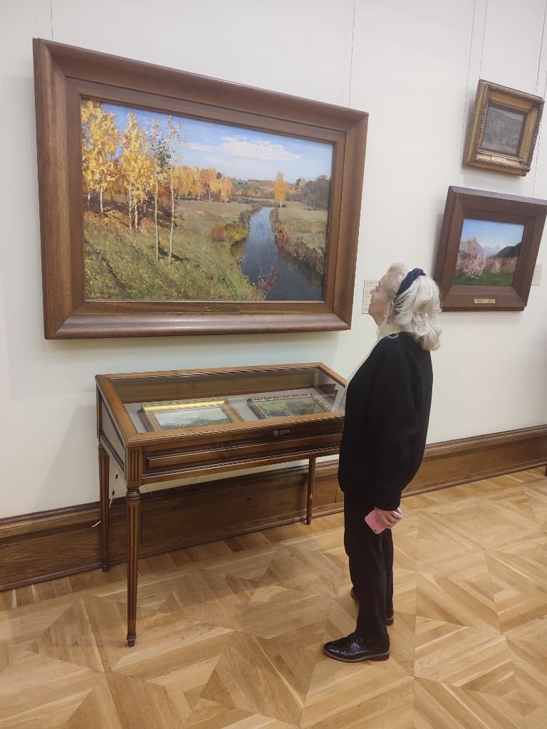 Francesca de Bardin looking at Isaac Levitan’s Golden Autumn, 1895, in the Tretyakov Gallery.