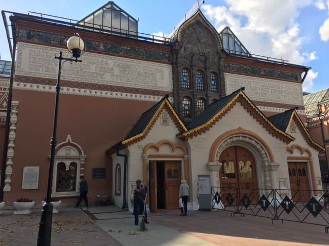 The entrance of the State Tretyakov Gallery in Moscow, with its painted facade and wooden doors.